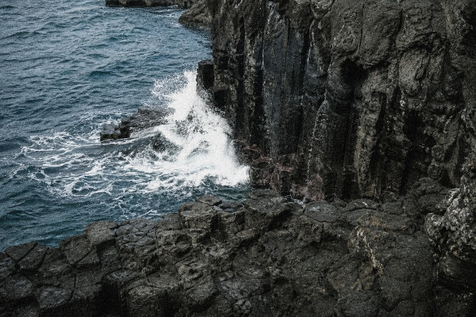 Jeju volcanic coast and green headland