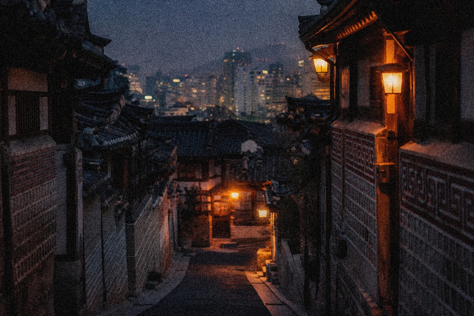 Hanok roofs and courtyard in Seoul at dusk